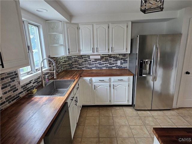 3978 Thrush Ln, Clay, NY 13090 - kitchen with wooden counters, stainless steel fridge, dishwashing machine, white cabinetry, and tasteful backsplash