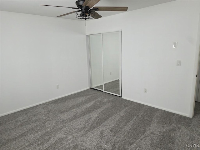 3978 Thrush Ln, Clay, NY 13090 - unfurnished bedroom with dark colored carpet, a closet, and a ceiling fan