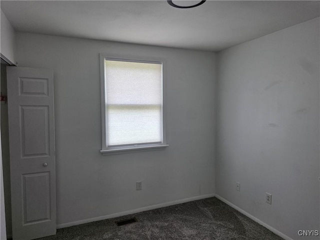 3978 Thrush Ln, Clay, NY 13090 - spare room with dark colored carpet and baseboards