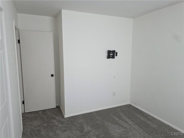 3978 Thrush Ln, Clay, NY 13090 - spare room with dark colored carpet and baseboards