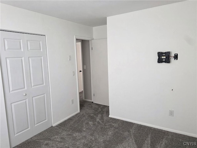 3978 Thrush Ln, Clay, NY 13090 - unfurnished bedroom featuring dark carpet and baseboards