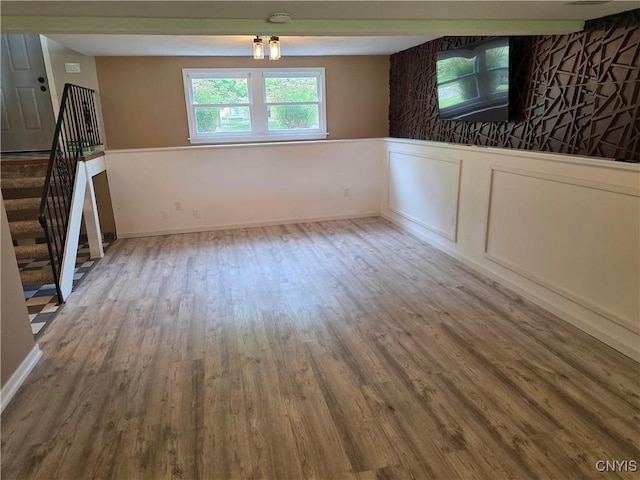 3978 Thrush Ln, Clay, NY 13090 - empty room with wood finished floors, stairs, and a smoke detector