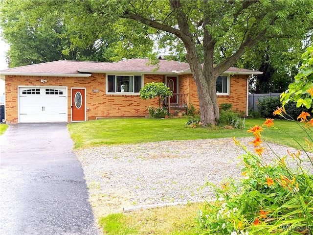 653 S S Colony Rd, Grand Island, NY 14072 - view of front of property with driveway, a garage, and brick siding