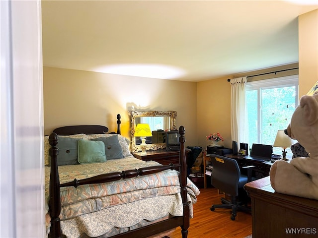 653 S S Colony Rd, Grand Island, NY 14072 - bedroom featuring wood finished floors and an office area