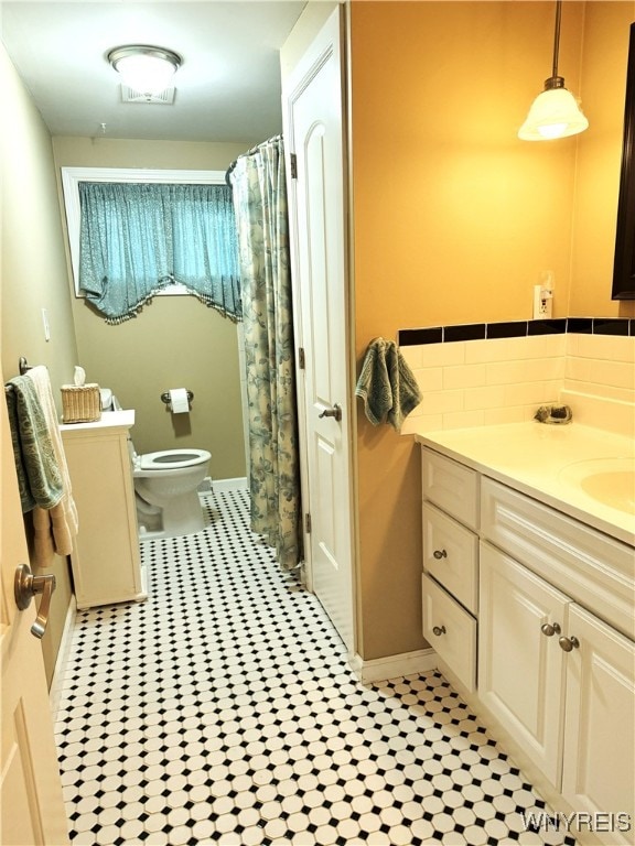 653 S S Colony Rd, Grand Island, NY 14072 - bathroom with vanity, tasteful backsplash, and tile patterned flooring