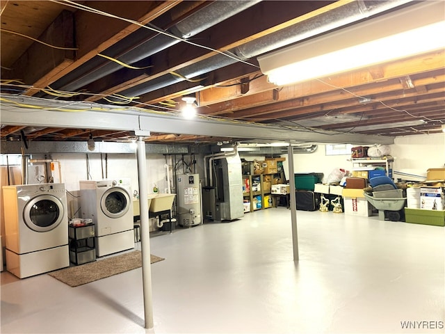653 S S Colony Rd, Grand Island, NY 14072 - basement featuring water heater, washer and dryer, and heating unit