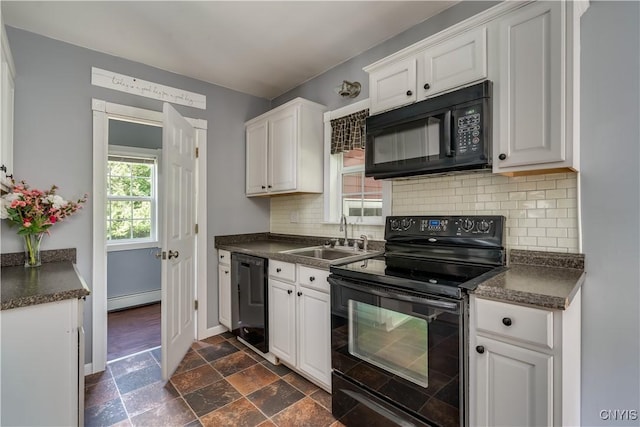 35095 State Route 3, Wilna, NY 13619 - kitchen featuring black appliances, dark countertops, a baseboard heating unit, white cabinets, and decorative backsplash