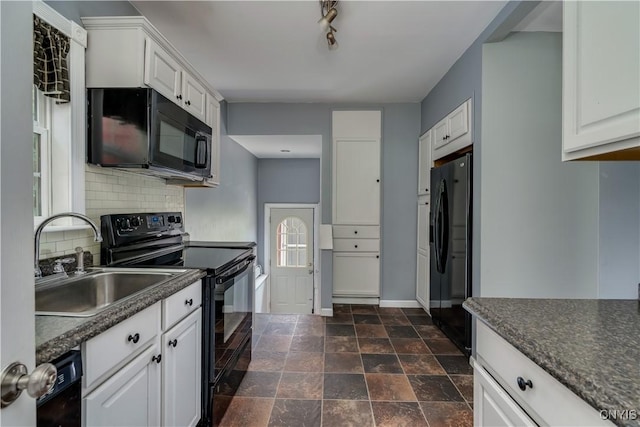 35095 State Route 3, Wilna, NY 13619 - kitchen with black appliances, dark countertops, tasteful backsplash, and white cabinetry