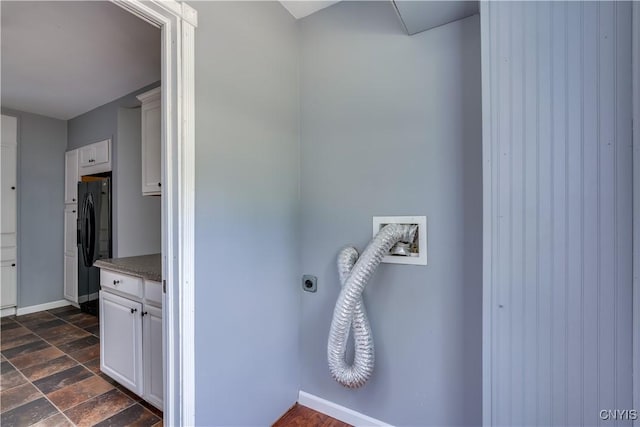 35095 State Route 3, Wilna, NY 13619 - washroom featuring electric dryer hookup, cabinet space, and dark stone finish floors