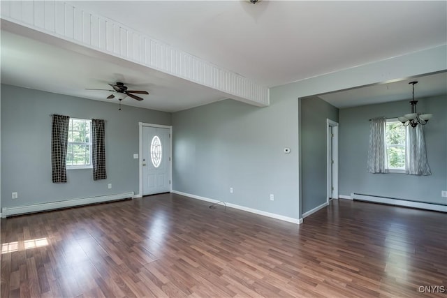 35095 State Route 3, Wilna, NY 13619 - unfurnished living room featuring a baseboard heating unit, a baseboard radiator, wood finished floors, and a chandelier