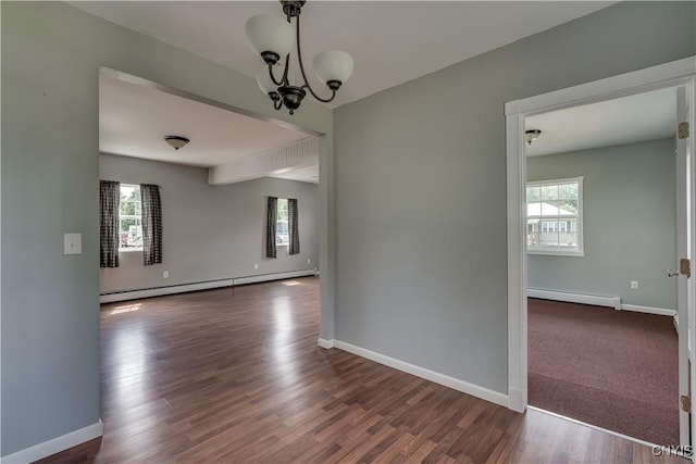 35095 State Route 3, Wilna, NY 13619 - unfurnished room with a baseboard radiator, healthy amount of natural light, and a chandelier