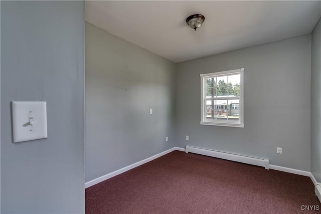 35095 State Route 3, Wilna, NY 13619 - unfurnished room with baseboard heating, dark carpet, and a baseboard heating unit