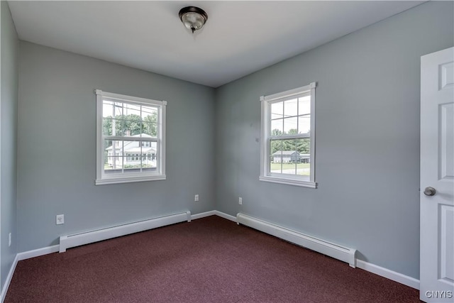 35095 State Route 3, Wilna, NY 13619 - unfurnished room with a baseboard heating unit, plenty of natural light, and dark colored carpet