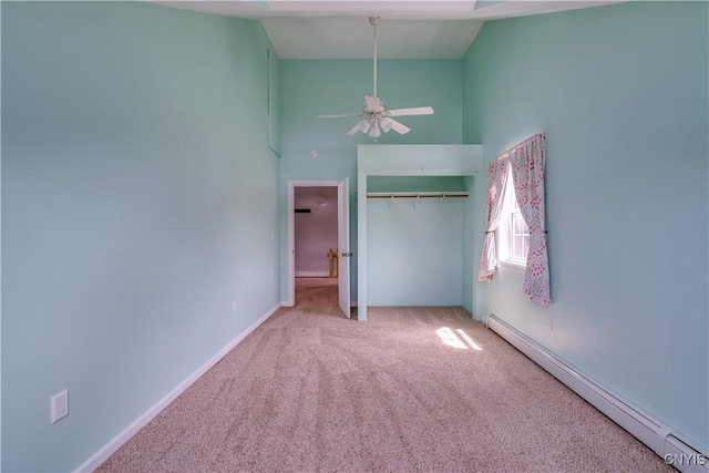35095 State Route 3, Wilna, NY 13619 - unfurnished bedroom featuring baseboard heating, high vaulted ceiling, carpet flooring, and a closet