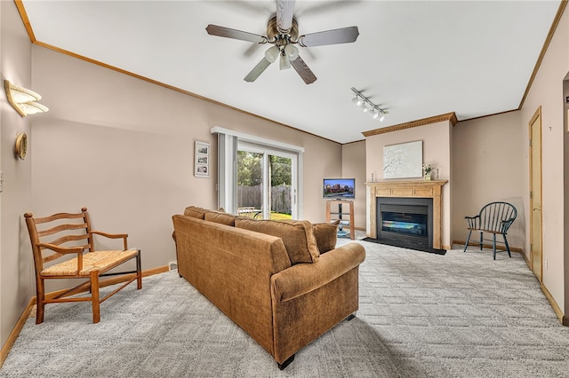 129 Patrice, Amherst, NY 14221 - living area with track lighting, ceiling fan, a fireplace with flush hearth, carpet flooring, and ornamental molding
