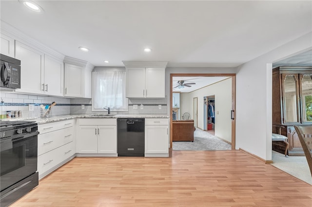 129 Patrice, Amherst, NY 14221 - kitchen with gas stove, black dishwasher, light wood-style flooring, tasteful backsplash, and a ceiling fan