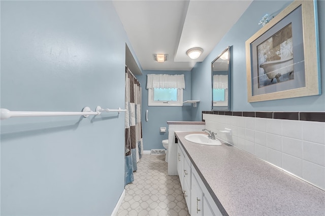 129 Patrice, Amherst, NY 14221 - bathroom featuring vanity, backsplash, and curtained shower