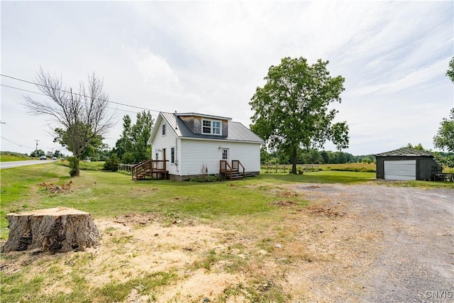 13051 State Route 3, Hounsfield, NY 13685 - view of property exterior featuring an outbuilding, driveway, a yard, and a garage