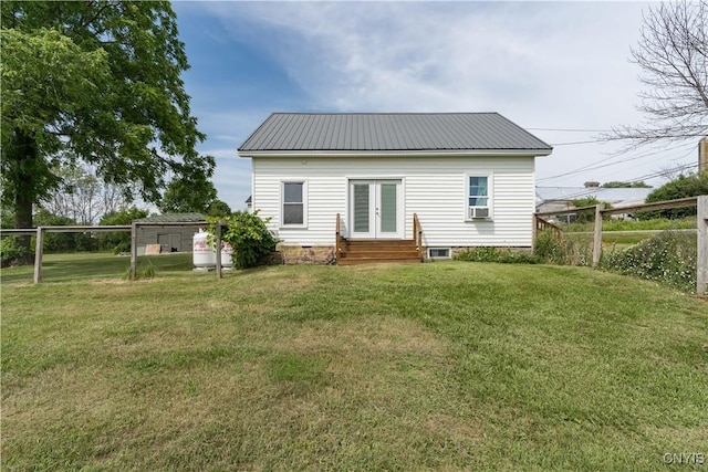 13051 State Route 3, Hounsfield, NY 13685 - back of house featuring entry steps, french doors, a yard, a metal roof, and cooling unit