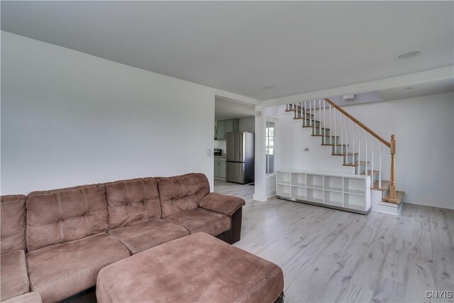 13051 State Route 3, Hounsfield, NY 13685 - living room featuring stairs and light wood-style floors