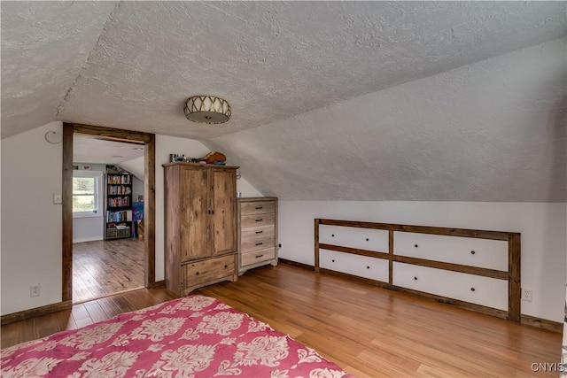 13051 State Route 3, Hounsfield, NY 13685 - bedroom with a textured ceiling, wood finished floors, and vaulted ceiling