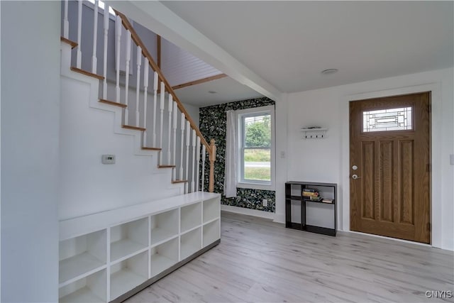 13051 State Route 3, Hounsfield, NY 13685 - foyer entrance featuring stairs, healthy amount of natural light, light wood-style flooring, and wallpapered walls