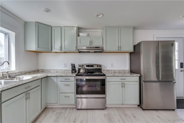 13051 State Route 3, Hounsfield, NY 13685 - kitchen with stainless steel appliances, under cabinet range hood, light stone counters, and light wood-type flooring