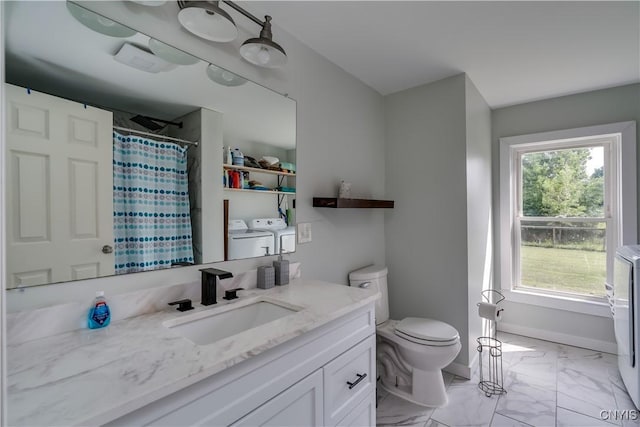 13051 State Route 3, Hounsfield, NY 13685 - bathroom featuring washing machine and clothes dryer, vanity, a shower with curtain, and marble look tiles