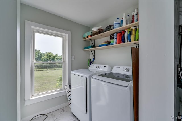 13051 State Route 3, Hounsfield, NY 13685 - laundry area featuring washing machine and dryer, light marble finish floors, and healthy amount of natural light
