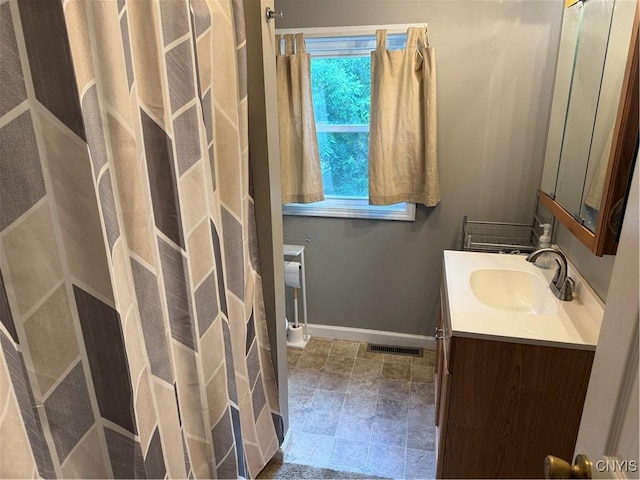 10 N 8th St, Fulton, NY 13069 - full bath with vanity and stone finish floors