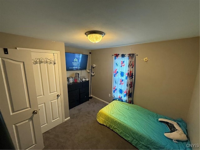 10 N 8th St, Fulton, NY 13069 - bedroom with dark carpet and baseboards