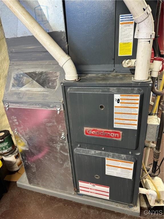 10 N 8th St, Fulton, NY 13069 - utility room featuring heating unit