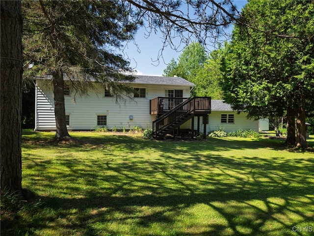 14496 Military Rd, Hounsfield, NY 13685 - back of property with stairs, a wooden deck, and a yard