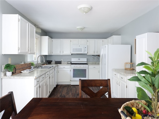 14496 Military Rd, Hounsfield, NY 13685 - kitchen featuring white appliances, dark wood-style flooring, white cabinetry, and light stone counters