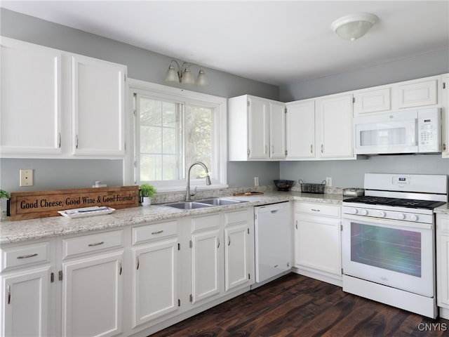 14496 Military Rd, Hounsfield, NY 13685 - kitchen with white appliances, white cabinetry, dark wood-style floors, and light stone counters