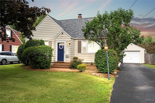 419 Bronson Rd, Geddes, NY 13219 - view of front of home featuring a shingled roof, a yard, a chimney, a garage, and asphalt driveway