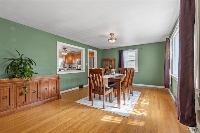 419 Bronson Rd, Geddes, NY 13219 - dining room featuring baseboards and light wood-style flooring