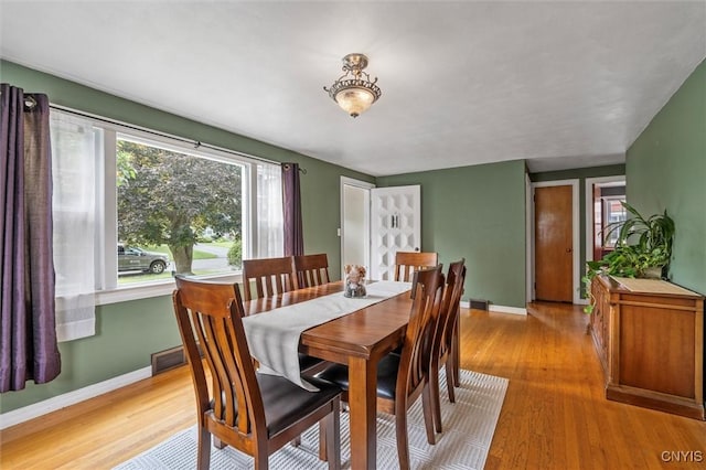 419 Bronson Rd, Geddes, NY 13219 - dining area with baseboards and light wood-style floors
