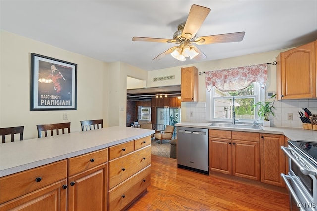 419 Bronson Rd, Geddes, NY 13219 - kitchen with stainless steel appliances, light countertops, and tasteful backsplash