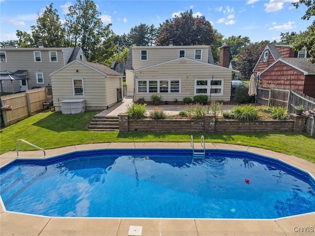 419 Bronson Rd, Geddes, NY 13219 - back of property featuring a fenced backyard and an outdoor structure