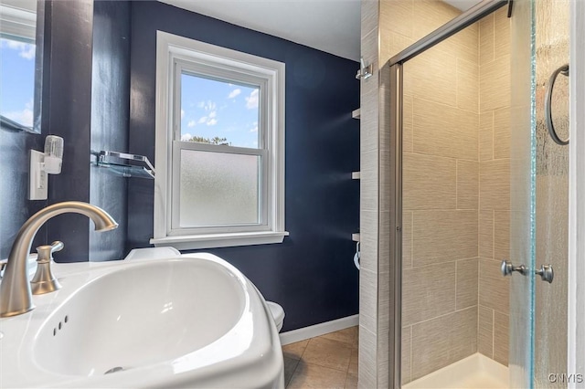 419 Bronson Rd, Geddes, NY 13219 - full bath with healthy amount of natural light, a shower stall, and tile patterned floors