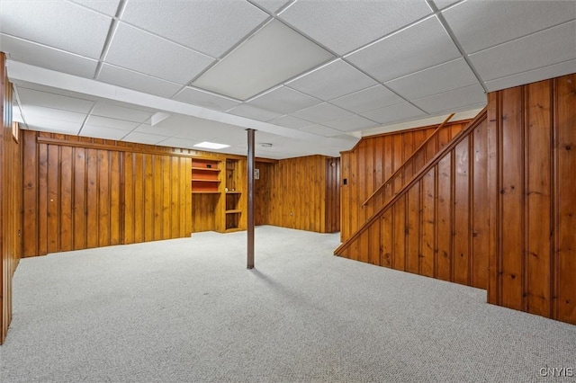 419 Bronson Rd, Geddes, NY 13219 - finished below grade area with carpet floors, wooden walls, a paneled ceiling, and stairway