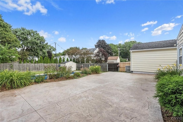 419 Bronson Rd, Geddes, NY 13219 - fenced backyard with a patio area and a shed