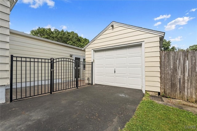 419 Bronson Rd, Geddes, NY 13219 - detached garage with driveway and a gate