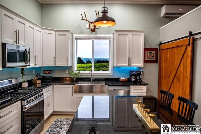 942 Spencer Rd, Kiantone, NY 14701 - kitchen with stainless steel appliances, a wall unit AC, dark stone counters, pendant lighting, and white cabinets
