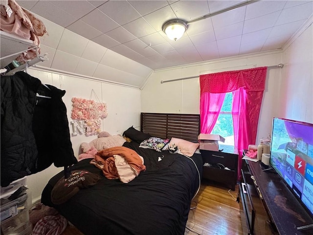 380 Sawyer St, Rochester, NY 14619 - bedroom featuring wood finished floors and vaulted ceiling