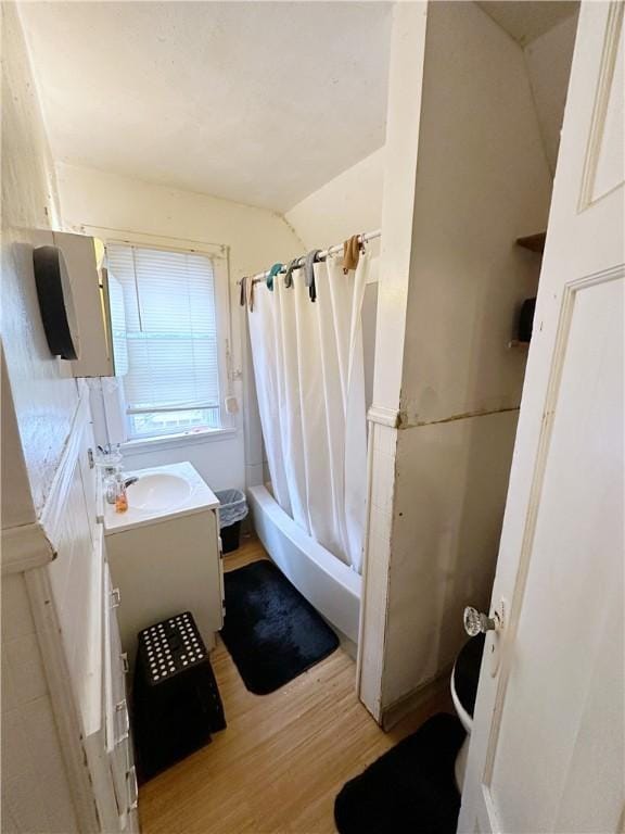 380 Sawyer St, Rochester, NY 14619 - full bathroom featuring vanity, wood finished floors, and shower / bathtub combination with curtain