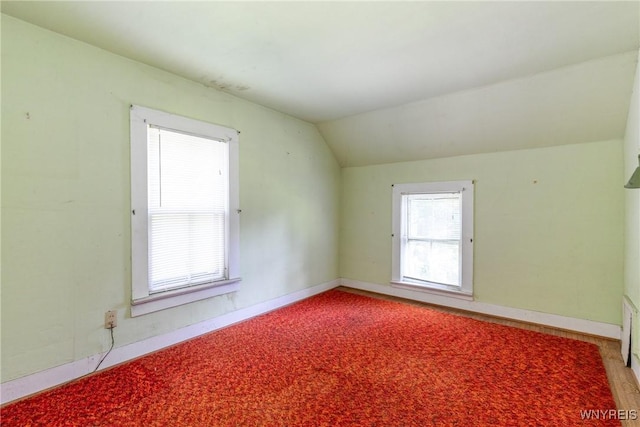 2458 Hess Rd, Newfane, NY 14008 - spare room featuring lofted ceiling and baseboards