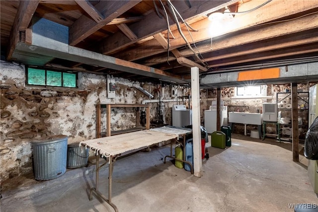 2458 Hess Rd, Newfane, NY 14008 - below grade area featuring a workshop area and washer and dryer