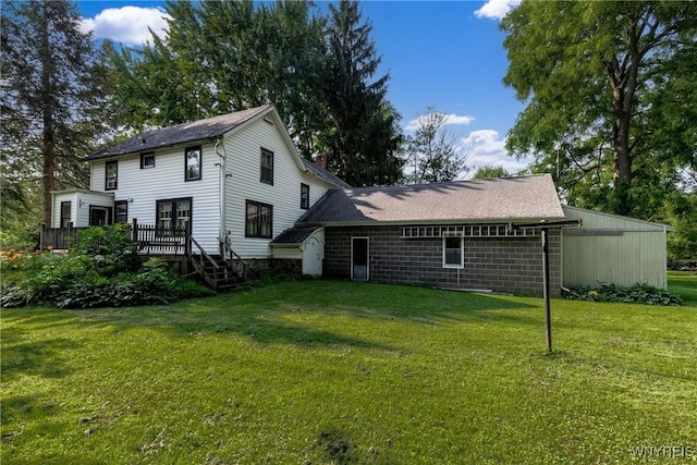 2458 Hess Rd, Newfane, NY 14008 - back of house featuring a wooden deck, a lawn, and a chimney